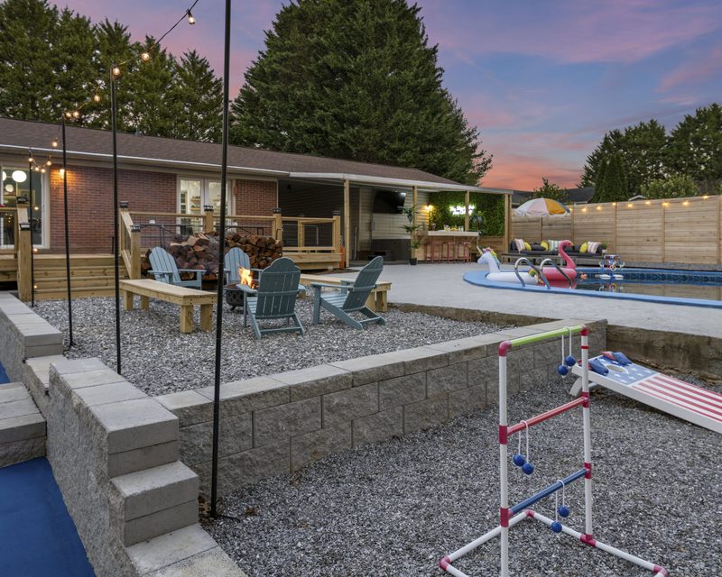 Backyard fire pit and pool area at an Anchor-managed Asheville property