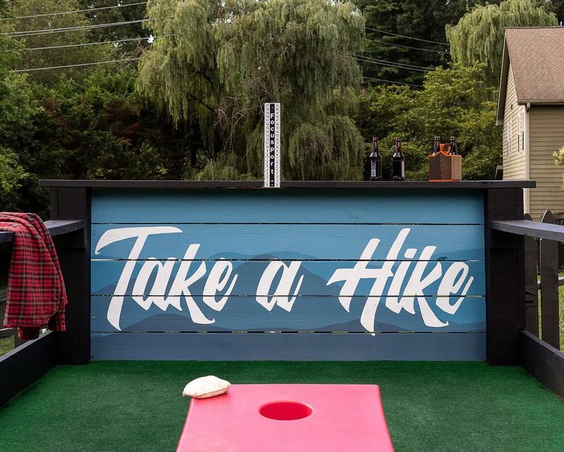 Backyard cornhole game at an Anchor-managed Asheville property